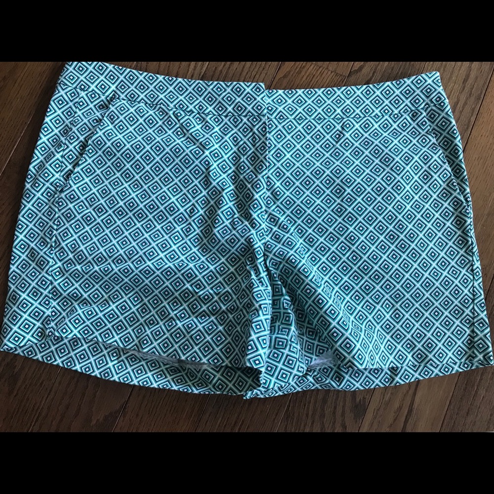 Blue... maybe black, green and white shorts